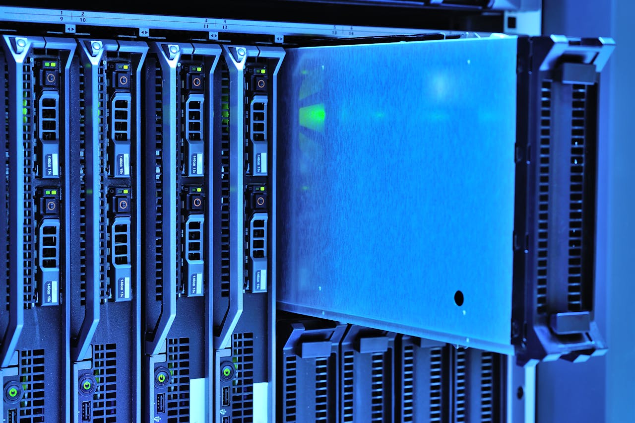 Mastering the First Impression: Your intriguing post title goes here Detailed view of server racks with glowing lights in a data center environment.